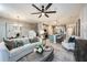 Open-concept living room is bright and airy, featuring stylish furnishings and decor at 540 Southern Edge Way, Sanford, FL 32771