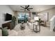 Relaxing living room featuring modern décor and a sliding glass door to the lanai at 540 Southern Edge Way, Sanford, FL 32771