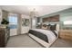 Serene main bedroom with waterfront views, elegant furnishings, and designer accents at 540 Southern Edge Way, Sanford, FL 32771