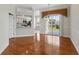 Dining room with hardwood floors, decorative chandelier, and sliding glass doors leading to the outside at 7021 Della Dr # 51, Orlando, FL 32819