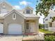 Charming two-story home with a one car garage and a well-maintained front yard at 7021 Della Dr # 51, Orlando, FL 32819