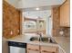 Cozy kitchen features stainless steel appliances, tiled backsplash, and a view to the living area at 7021 Della Dr # 51, Orlando, FL 32819