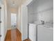 Laundry room with a side-by-side washer and dryer and an open doorway to another room at 7021 Della Dr # 51, Orlando, FL 32819