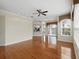 Inviting living room with hardwood floors, a ceiling fan, recessed lighting, and a view to the kitchen at 7021 Della Dr # 51, Orlando, FL 32819