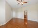 Spacious main bedroom with wood floors and a ceiling fan at 7021 Della Dr # 51, Orlando, FL 32819