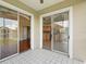 Tiled outdoor patio provides access to the kitchen and living room through sliding glass doors at 7021 Della Dr # 51, Orlando, FL 32819