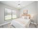 Bedroom with a light color scheme, fan, and natural light from the window at 711 Swan Ln, Altamonte Springs, FL 32701