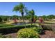 Picturesque community lake with a fountain and palm trees, enhancing the scenic environment at 711 Swan Ln, Altamonte Springs, FL 32701