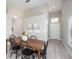 Well-lit dining area with stylish decor and easy access to the kitchen and entrance at 711 Swan Ln, Altamonte Springs, FL 32701