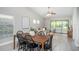 Open dining area features bright lighting and seamless flow into the living room and screened porch at 711 Swan Ln, Altamonte Springs, FL 32701
