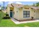 Charming single-story home showcasing a blue front door and manicured landscaping at 711 Swan Ln, Altamonte Springs, FL 32701