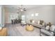 Spacious living area showcases a blend of dining and seating space with natural light at 711 Swan Ln, Altamonte Springs, FL 32701