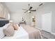Comfortable main bedroom boasts a ceiling fan, ensuite bath access, and a large closet for ample storage at 711 Swan Ln, Altamonte Springs, FL 32701