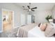 Open main bedroom with ensuite bathroom access, closet and fan, creates a relaxing private space at 711 Swan Ln, Altamonte Springs, FL 32701