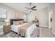 Bright main bedroom features a ceiling fan, neutral paint, and a decorative rug creating a cozy atmosphere at 711 Swan Ln, Altamonte Springs, FL 32701