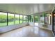Enclosed sunroom with tiled flooring, great for indoor-outdoor living and entertaining at 711 Swan Ln, Altamonte Springs, FL 32701
