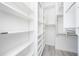 Organized walk-in closet with built-in shelving provides ample storage space for clothes and accessories at 711 Swan Ln, Altamonte Springs, FL 32701