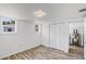 Bright bedroom features neutral walls, closet, and windows for ample natural light at 730 S Main Ave, Groveland, FL 34736