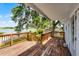View from the deck of the waterfront home surrounded by mature trees offering serene and peaceful outdoor living at 730 S Main Ave, Groveland, FL 34736