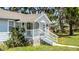 Charming single-Gathering home with stone accents, a cozy front porch, and well-maintained front yard at 730 S Main Ave, Groveland, FL 34736