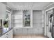 Bright kitchen with built-in shelving and cabinetry, offering plenty of storage and natural light at 730 S Main Ave, Groveland, FL 34736