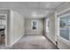 Bright living room featuring neutral walls, carpet floors, and two windows at 730 S Main Ave, Groveland, FL 34736