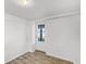 Neutral room with ample light, tile floors, and a door to the outside at 730 S Main Ave, Groveland, FL 34736