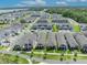 An aerial view of the neighborhood showcasing the home and surrounding community, with nearby houses and landscaping at 744 Yukon Ln, Debary, FL 32713