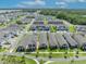 Aerial view depicts the property within a community with lush landscaping and convenient road networks at 744 Yukon Ln, Debary, FL 32713