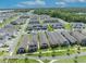 Aerial view of the neighborhood showcasing houses, landscaping, and community amenities in a well-planned layout at 744 Yukon Ln, Debary, FL 32713
