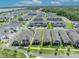 An aerial view of the neighborhood showcasing the home and surrounding community, with nearby houses and landscaping at 744 Yukon Ln, Debary, FL 32713