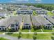Wide aerial view highlights this home among other properties in a beautifully landscaped neighborhood at 744 Yukon Ln, Debary, FL 32713