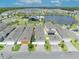 A high angle aerial view of the neighborhood with a lake, amenities, and meticulously planned residential community at 744 Yukon Ln, Debary, FL 32713