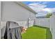Low-maintenance backyard with artificial turf and a privacy fence, perfect for outdoor entertaining and recreation at 744 Yukon Ln, Debary, FL 32713