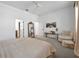 Spacious bedroom featuring a seating area, large mirror, and a walk-in closet for ample storage at 744 Yukon Ln, Debary, FL 32713