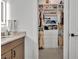 Well-organized walk-in closet with custom shelving, drawers, and ample space for clothing and accessories at 744 Yukon Ln, Debary, FL 32713