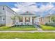 Charming single-story home with a manicured lawn, covered porch, and stone accents, creating inviting curb appeal at 744 Yukon Ln, Debary, FL 32713