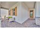Inviting front porch featuring stone accents, brick flooring, and modern accents at 744 Yukon Ln, Debary, FL 32713
