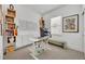 Bright home office with a modern desk, stylish shelves, and artful decor for a creative workspace at 744 Yukon Ln, Debary, FL 32713
