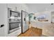 Modern kitchen appliances built into the wall open to the living area, stainless steel refrigerator at 744 Yukon Ln, Debary, FL 32713