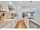Well-appointed kitchen boasts white cabinets, stainless appliances, and a light countertop at 744 Yukon Ln, Debary, FL 32713