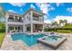 Gorgeous backyard with a private pool, spa, fire pit, and outdoor kitchen for entertaining at 7905 Jacks Club Dr, Kissimmee, FL 34747