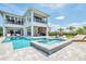 Stunning two-story home boasts a luxurious pool and spa, an outdoor kitchen and plenty of patio space at 7905 Jacks Club Dr, Kissimmee, FL 34747