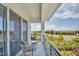 Relaxing balcony with seating and a view of lush landscaping, perfect for enjoying the outdoors at 7905 Jacks Club Dr, Kissimmee, FL 34747