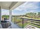 Serene balcony showcasing picturesque views of lush greenery and neighborhood scenery, ideal for relaxing outdoors at 7905 Jacks Club Dr, Kissimmee, FL 34747