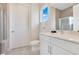 Bright bathroom with marble countertops, a glass-enclosed shower, and modern fixtures for a spa-like experience at 7905 Jacks Club Dr, Kissimmee, FL 34747
