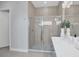 Modern bathroom with a glass-enclosed shower, stylish tile work, and sleek fixtures for a spa-like experience at 7905 Jacks Club Dr, Kissimmee, FL 34747