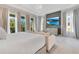 Elegant bedroom with a sleek TV, modern decor, and ample natural light for a luxurious and comfortable space at 7905 Jacks Club Dr, Kissimmee, FL 34747