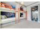 Bedroom with custom built-in bunk beds featuring a Star Wars themed design and a cartoon door at 7905 Jacks Club Dr, Kissimmee, FL 34747