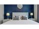 Serene bedroom with a plush bed, stylish lighting, and elegant decor for a restful atmosphere at 7905 Jacks Club Dr, Kissimmee, FL 34747